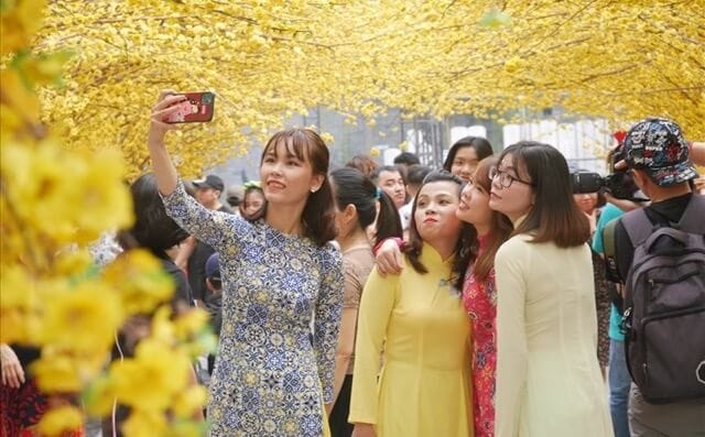 You will see many people wearing Áo dài during the Lunar New Year holiday.