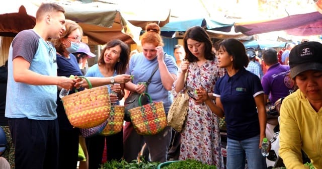 Tourists enjoy wandering around the Tet markets in Vietnam