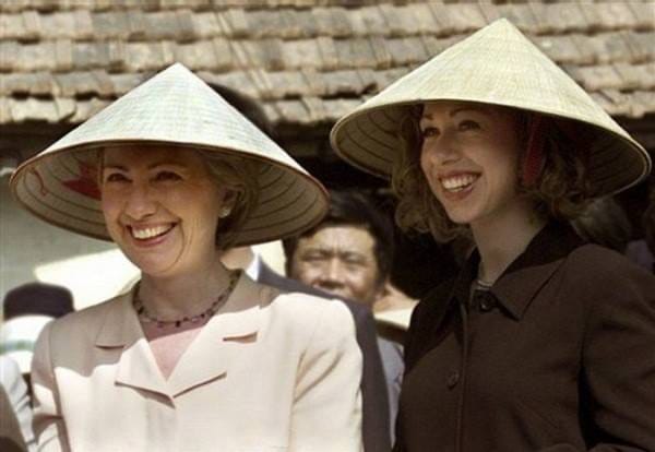 Two beautiful women with a Vietnamese conical hat.